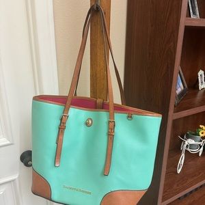 Stunning Dooney & Bourke. Used, wear left, study and heavy lots of pockets teal